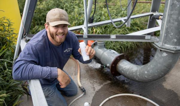 NRD Employee takes water sample