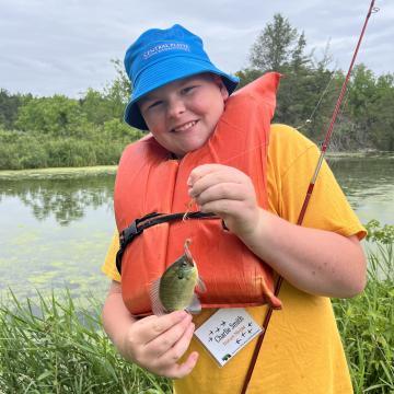 ACE Camper with a fish