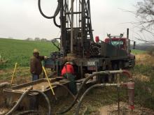 Surveying a well for good water quality.