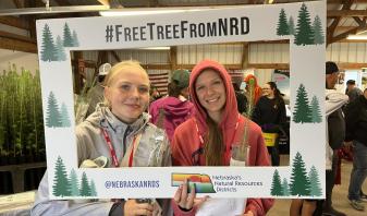 FFA Students get a free tree from NRD at Husker Harvest Days.