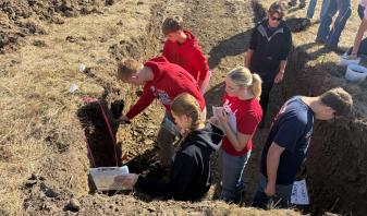 Students in a soil pit for land judging.