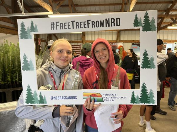 FFA Students get a free tree from NRD at Husker Harvest Days.