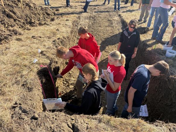 Students in a soil pit for land judging.