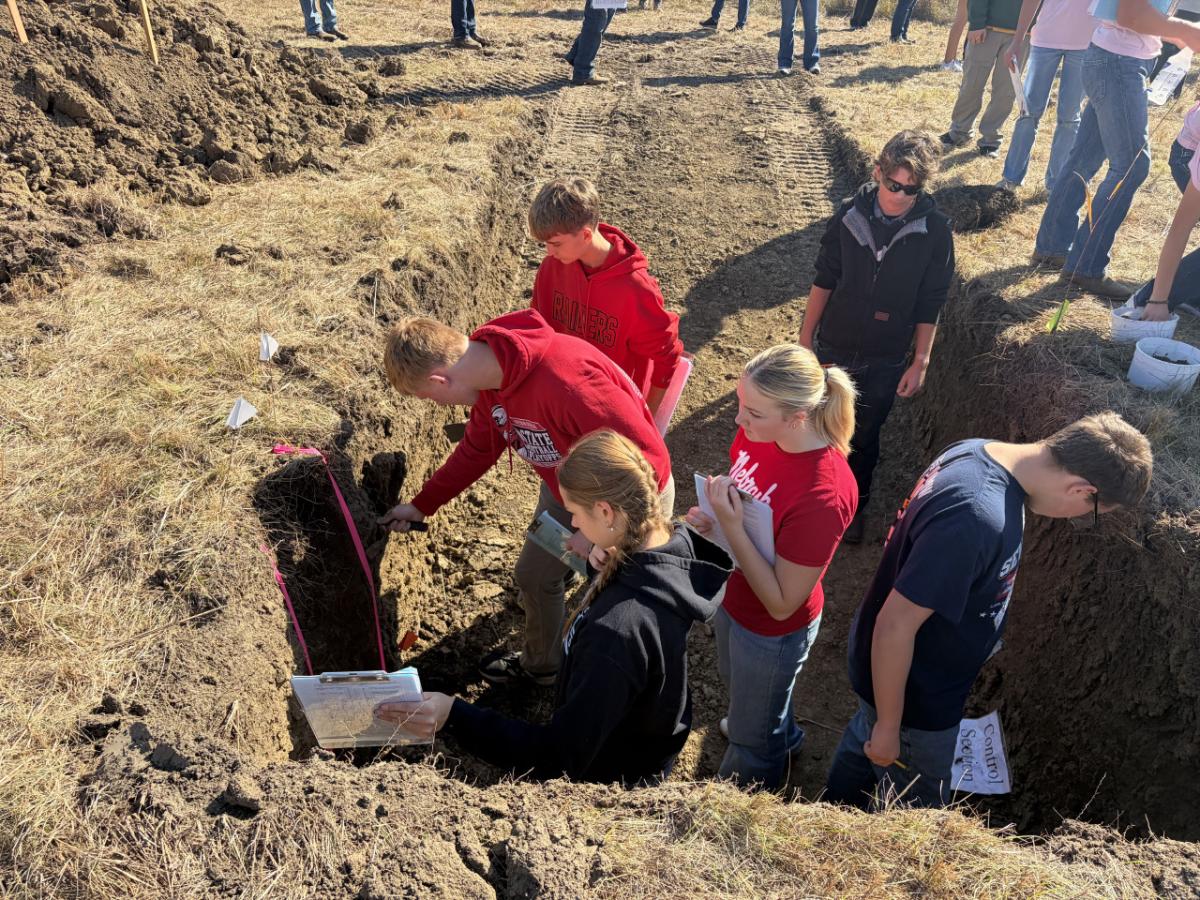 Students in a soil pit for land judging.